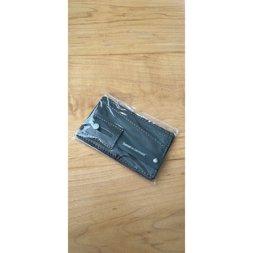 Damsel in defense | sticky wallet for your phone case